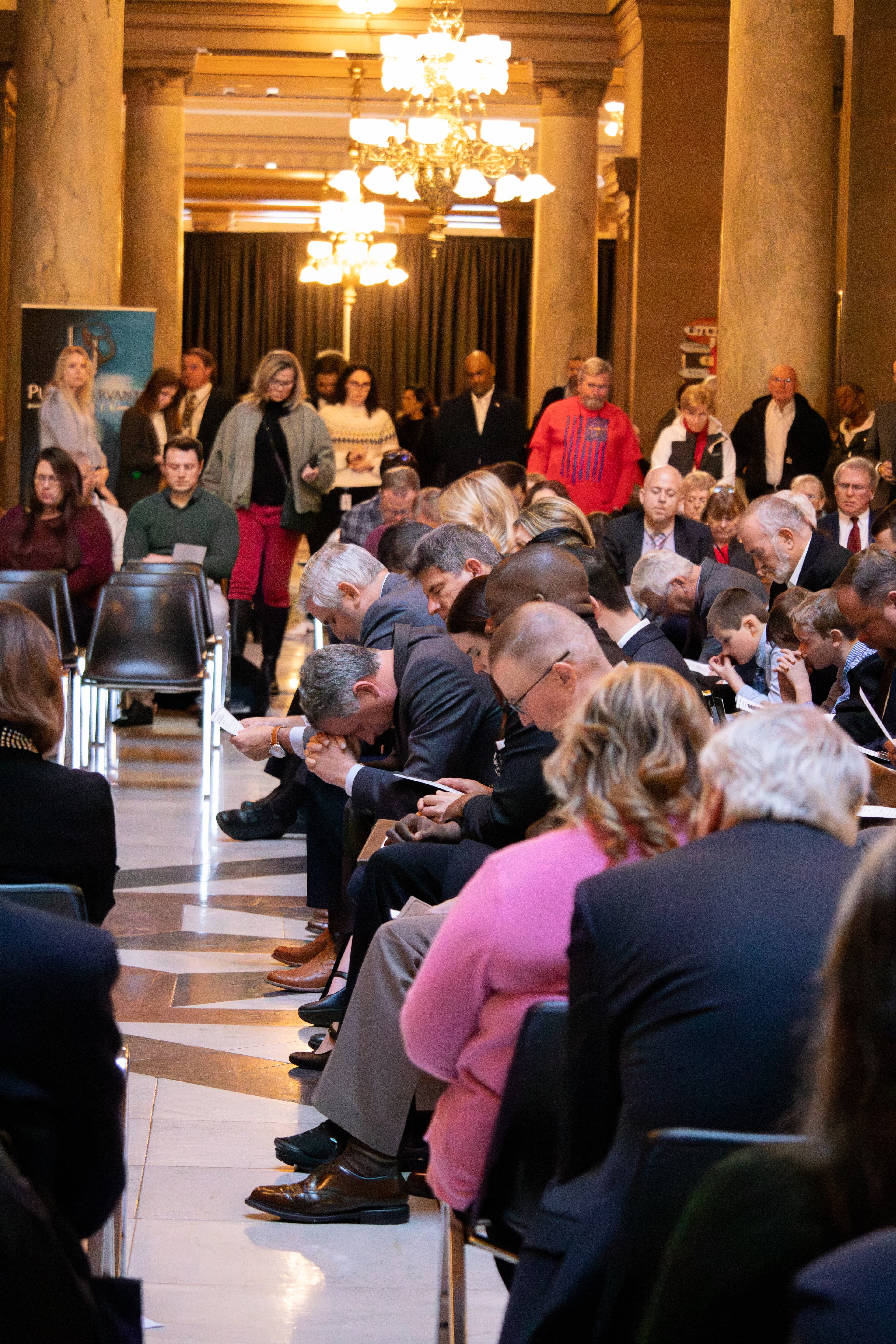 Attendees praying at the 21st Annual Statehouse Prayer Service