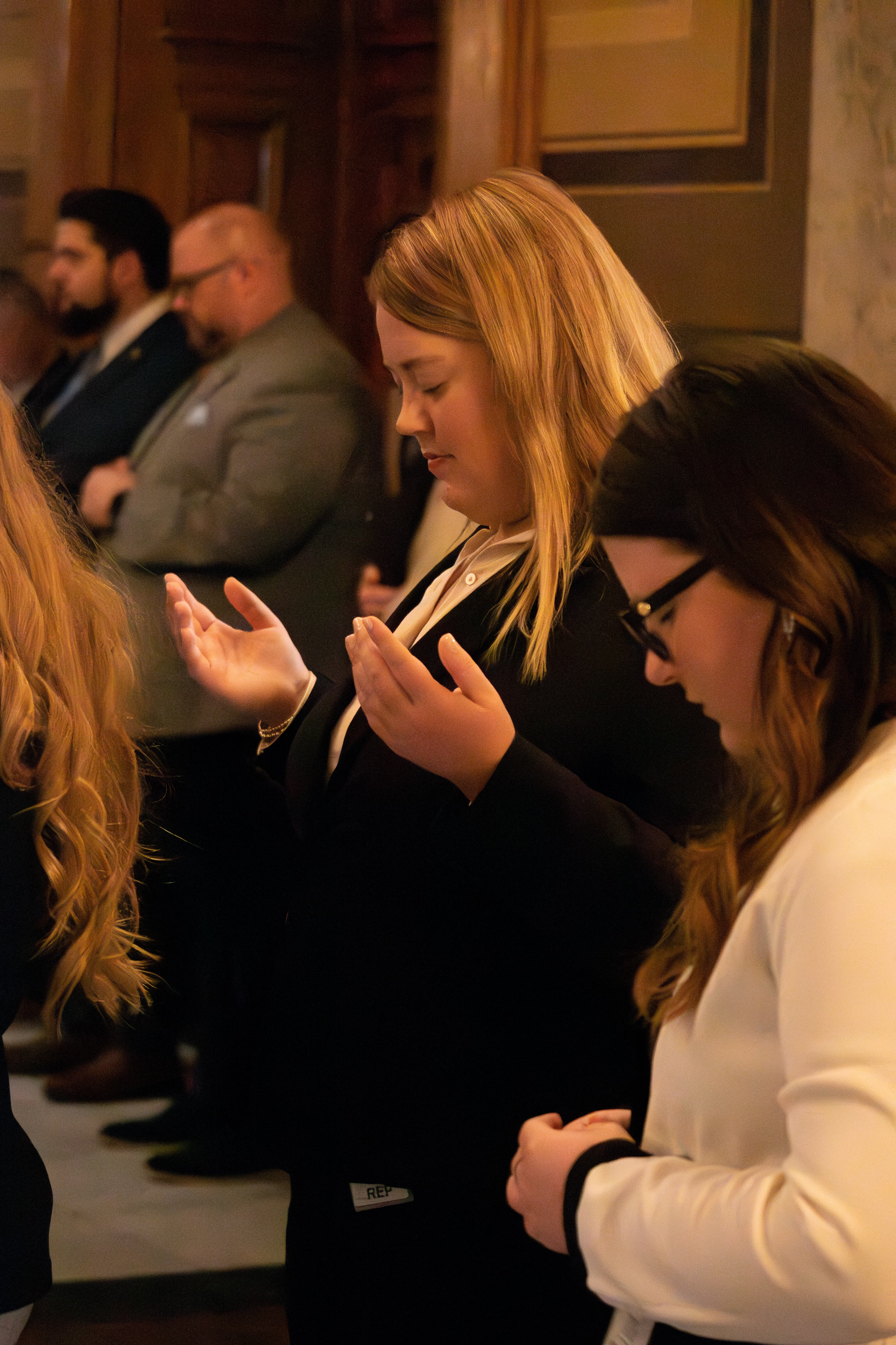 Attendees praying at the 21st Annual Statehouse Prayer Service