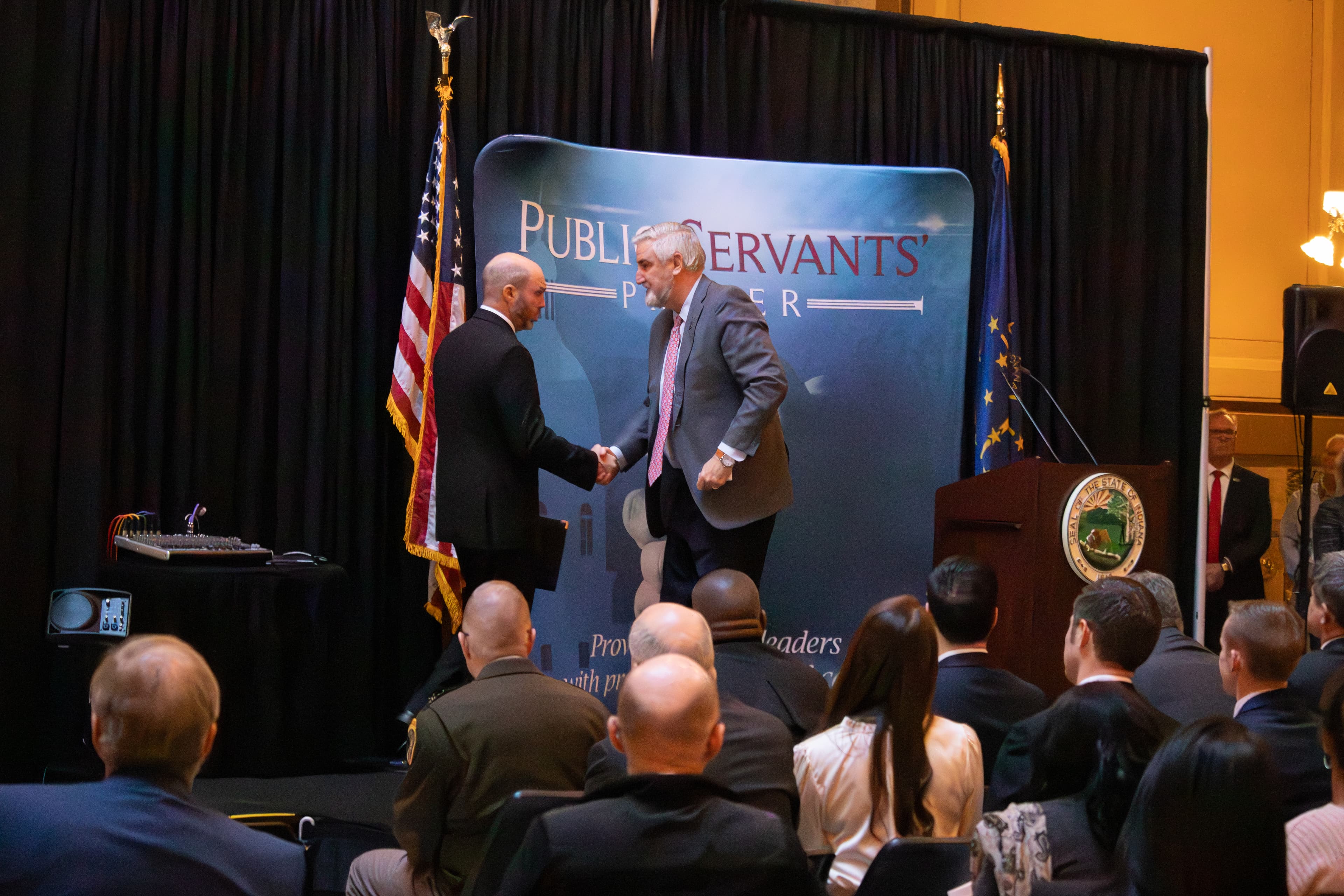 Governor Eric Holcomb and Chaplain Matthew Barnes shaking hands