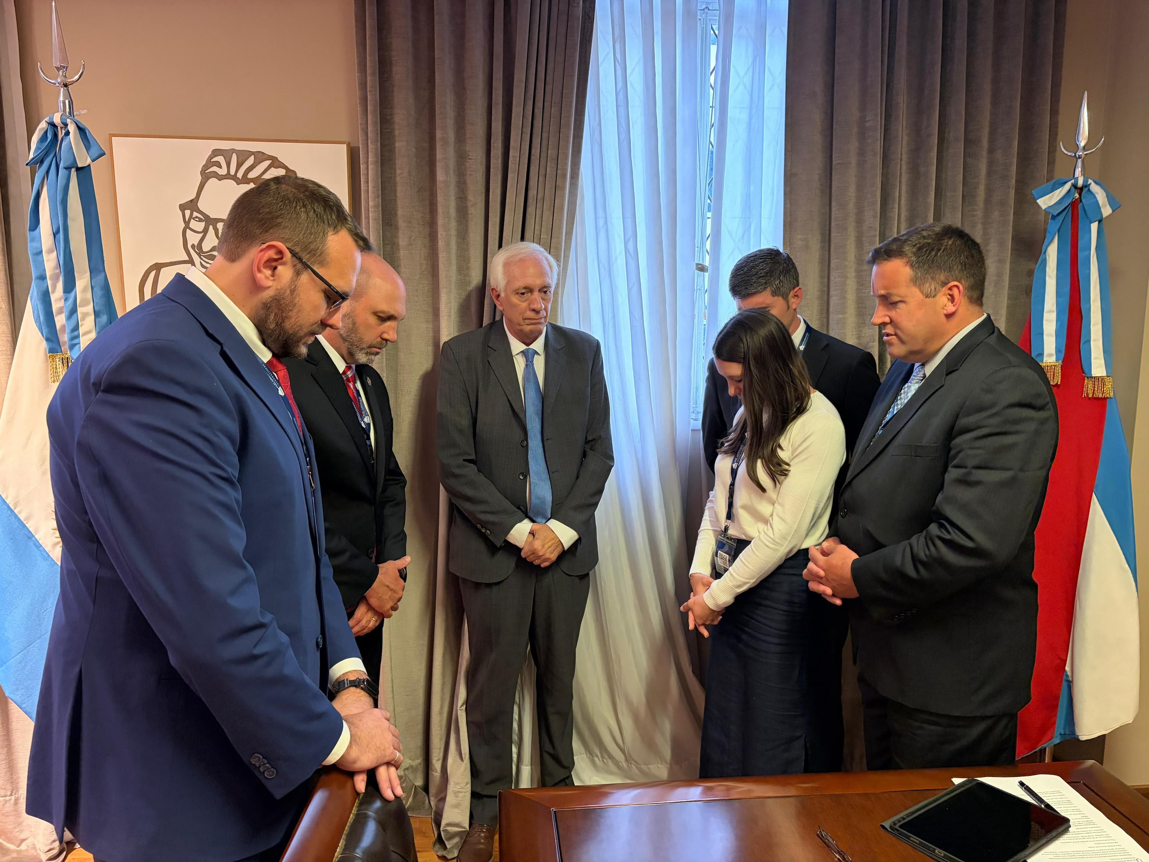 Praying with Argentine Economic Development Director