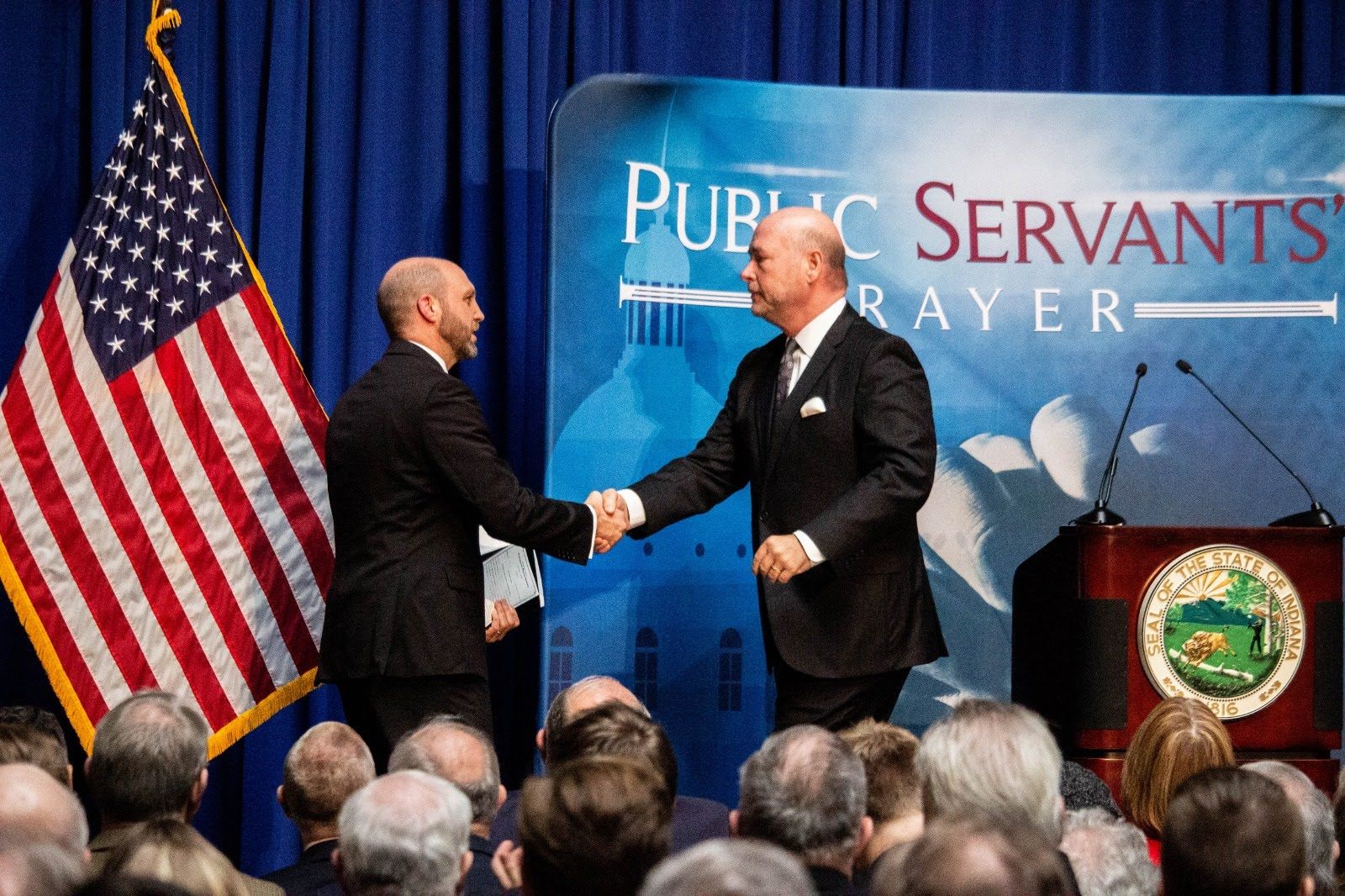 Speaker of the House and Matt Barnes shaking hands